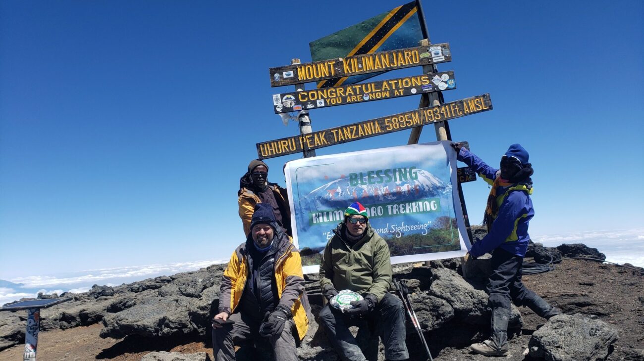 climbers at the summit of kilimanjaro ,the trip went through machame route