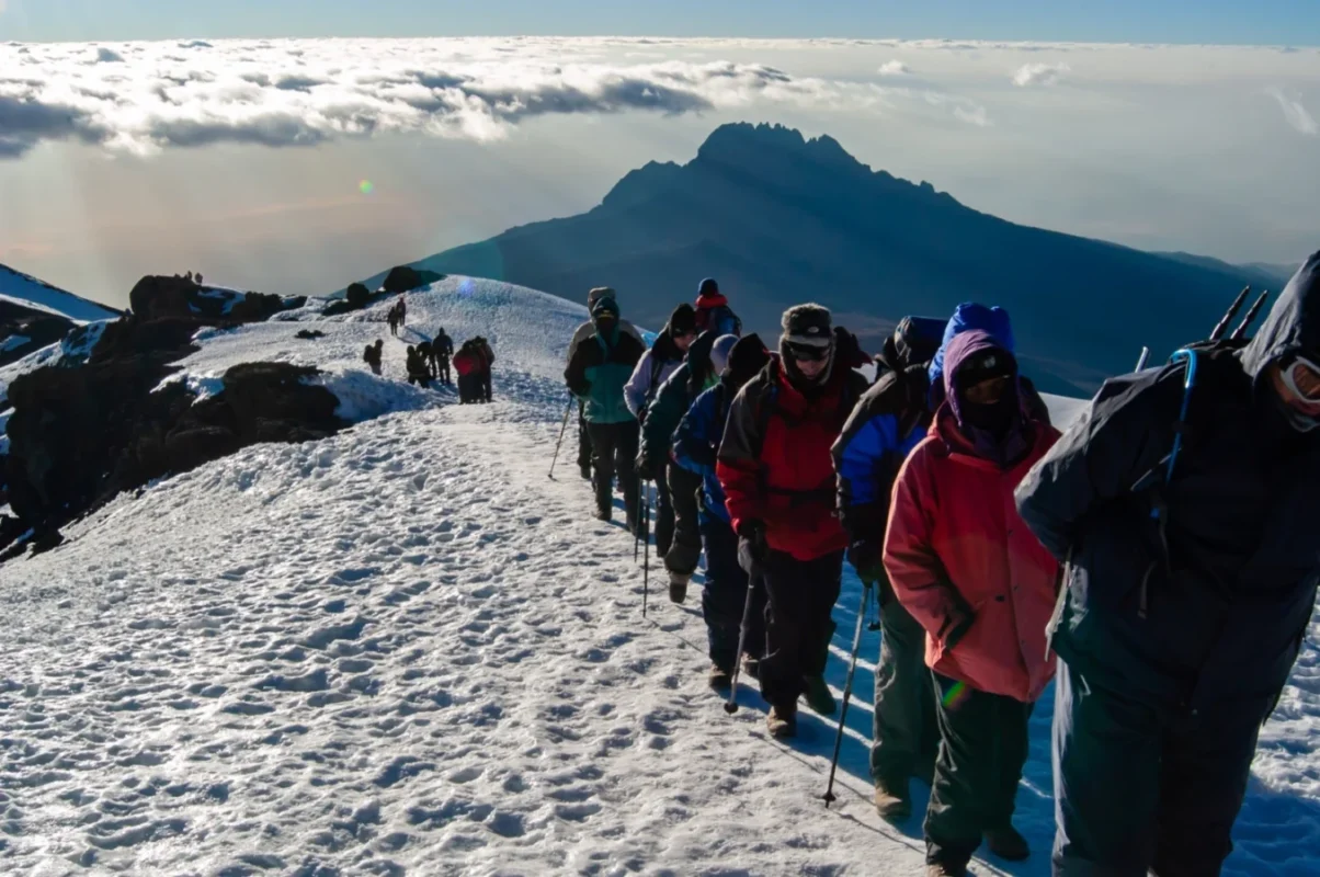 climbing-mount-kilimanjaro-via-umbe-route umbwe route climber walking toward the summit of Kilimanjaro