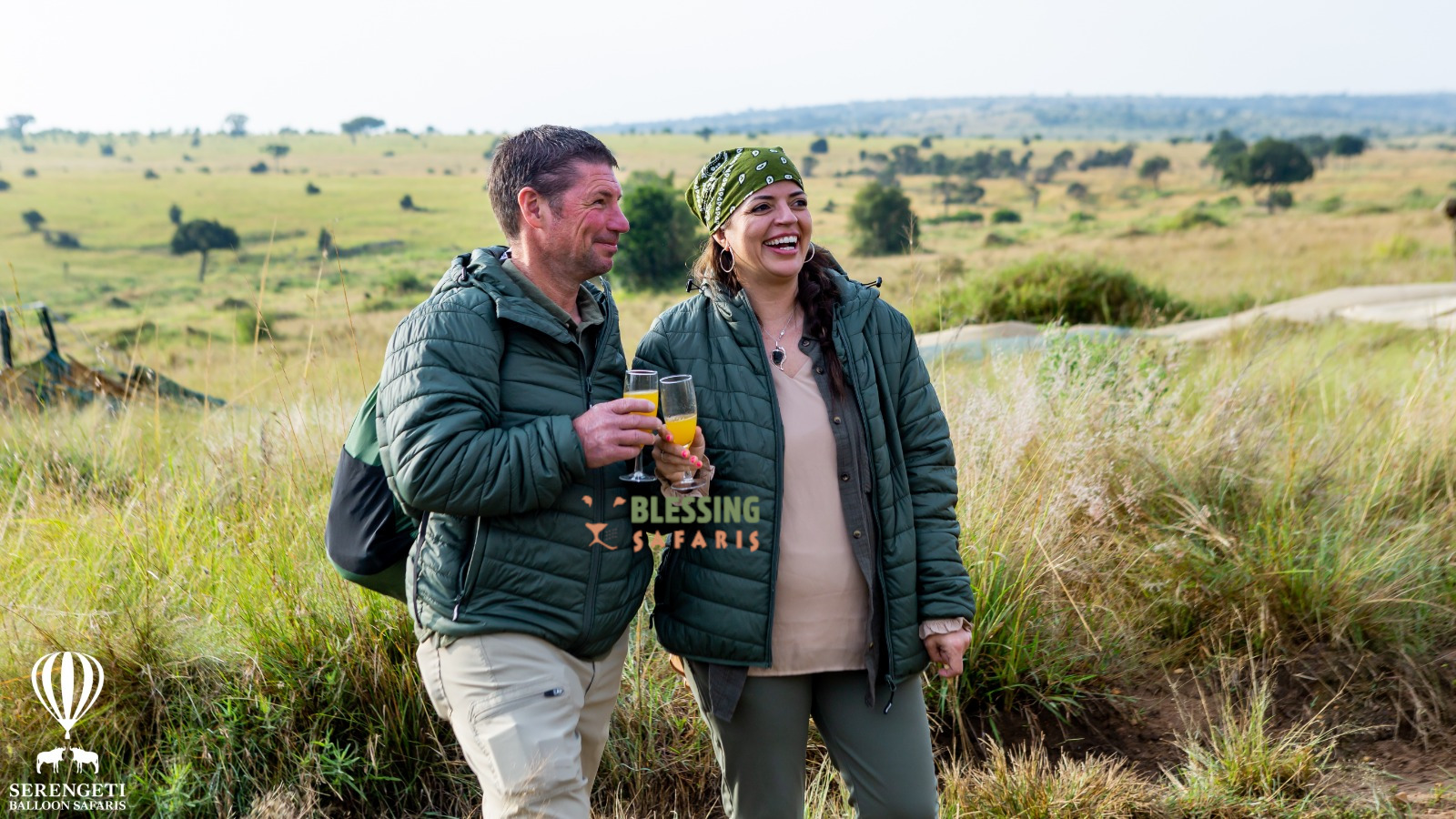 serengeti signature safari , client pausing for photo after balloon flight in Serengeti